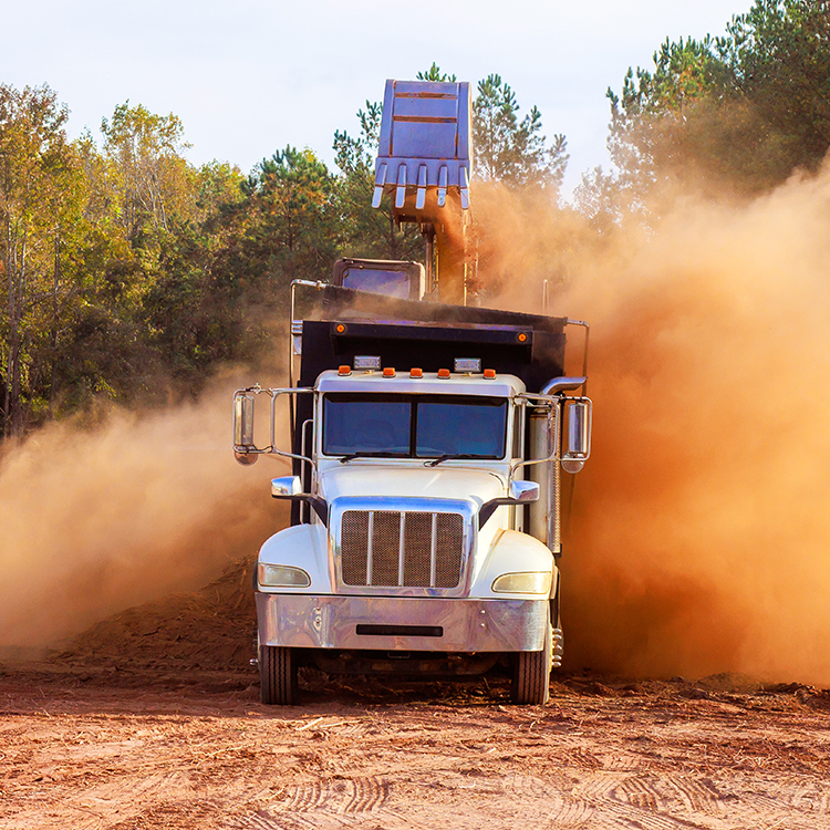 Truck Driving Through Dust